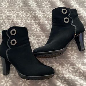Black zip booties with silver accent on side